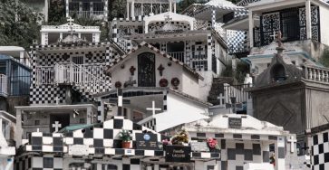 Morne-à-l'Eau Cemetery's striking black and white graves form a unique visual pattern.