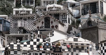 Morne-à-l'Eau Cemetery's striking black and white graves form a unique visual pattern.