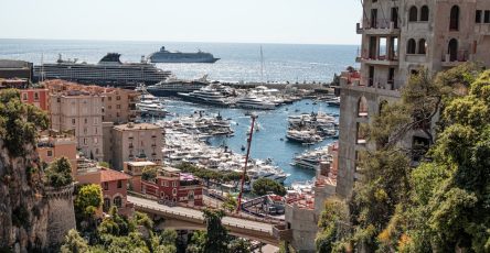 Scenic view of a harbor filled with yachts.